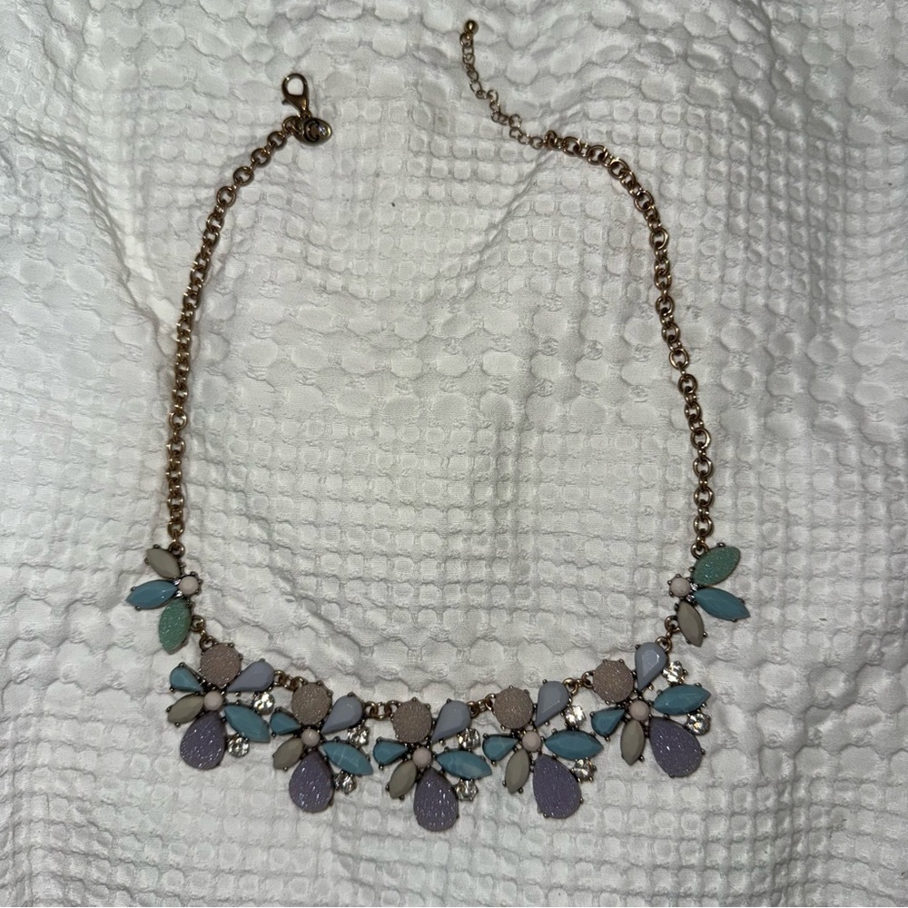 Charming Charlie’s light blue, lavender, sparkly gold tone statement necklace